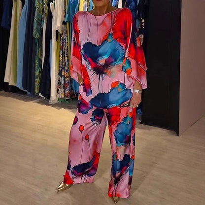 Damen Zweiteiler Set – Off Shoulder Top mit Fledermausärmeln – Weite High-Waist Hose – Seidenähnlich – Künstlerischer Print